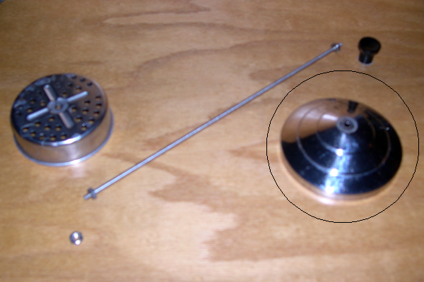Dissassembly of the disinfecting jar lid.  Only the circled part is used.