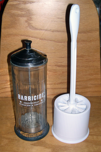 Off-the-shelf parts used to create the self-disinfecting toilet brush:  a standard round plastic toilet brush and a glass barbershop disinfecting jar.